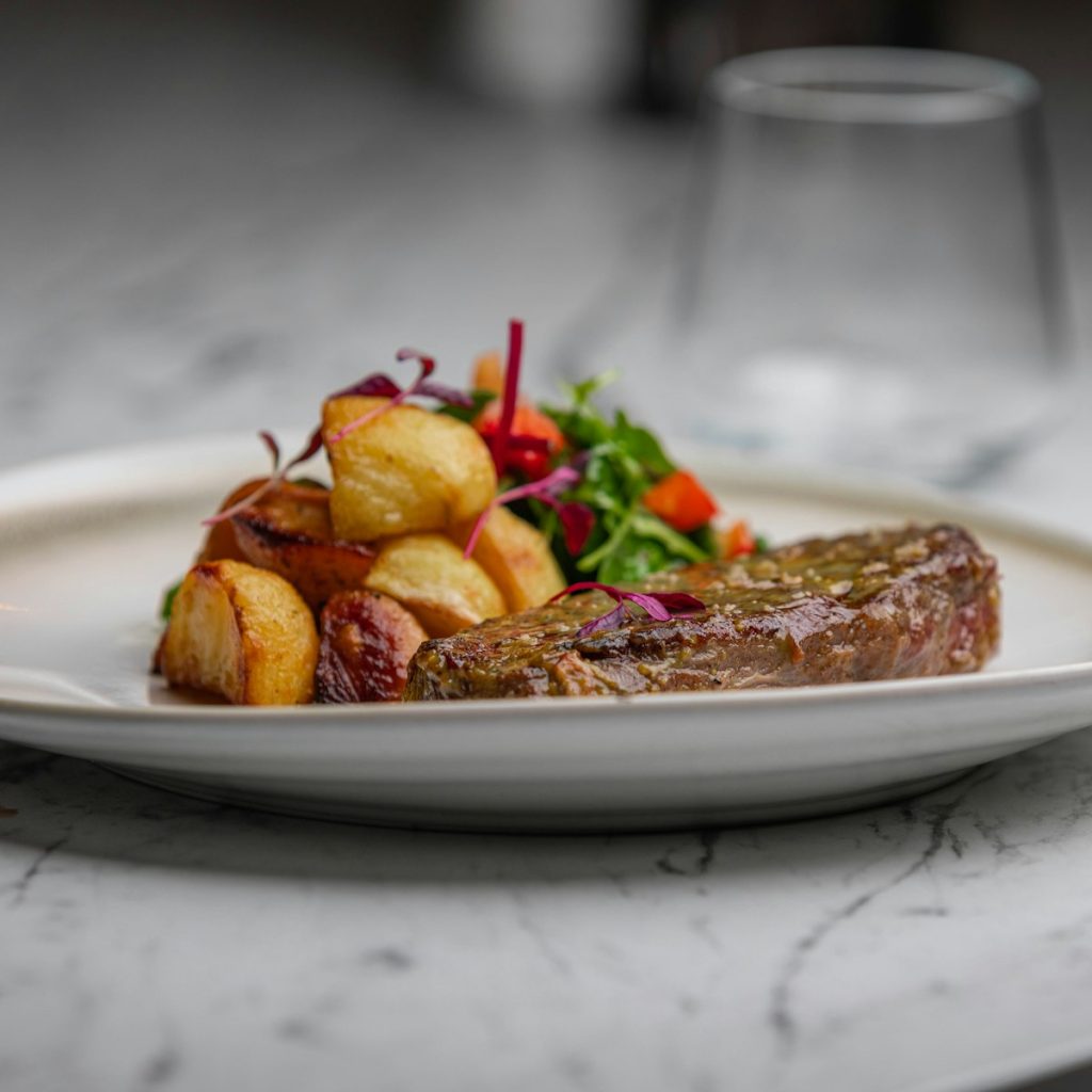 Steak dinner on a wooden board